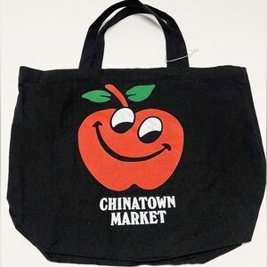 Chinatown Market Unisex Black Cotton Canvas Large Grinning Apple Print Tote Bag
